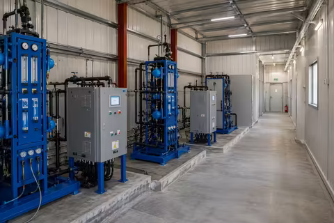 Water-treatment plant and process skids in the utility building