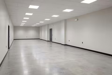 Finished office fitted with a suspended ceiling and LED panel lighting